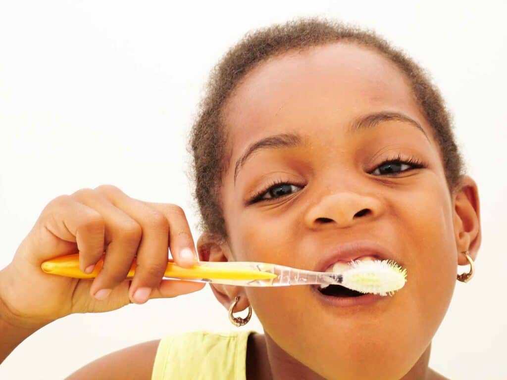 Young Girl Brushing Teeth in Pharr, TX