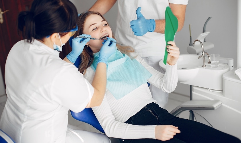 The necessity of anesthesia for tooth filling, showcasing a dental syringe administering local anesthetic to ensure patient comfort during the procedure.